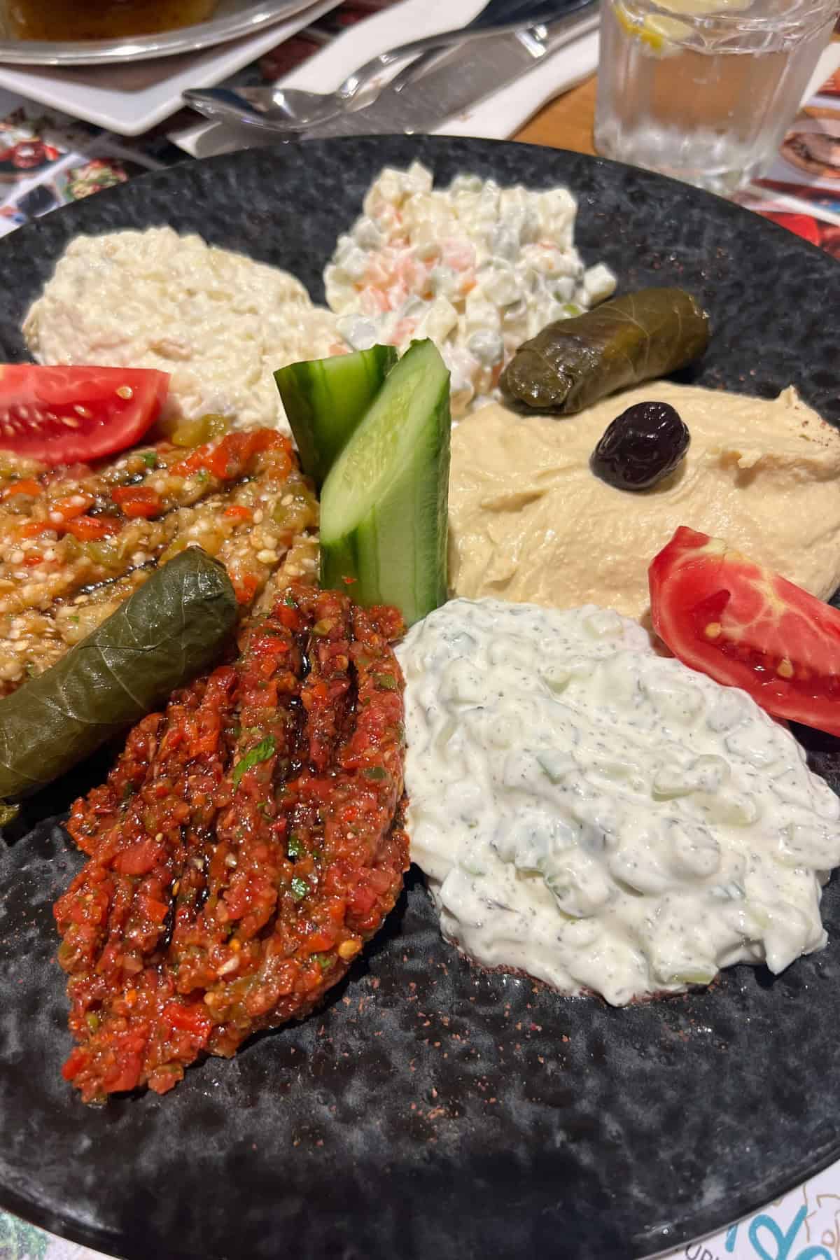 Turkish mezze plate to show cacik on one of the dips