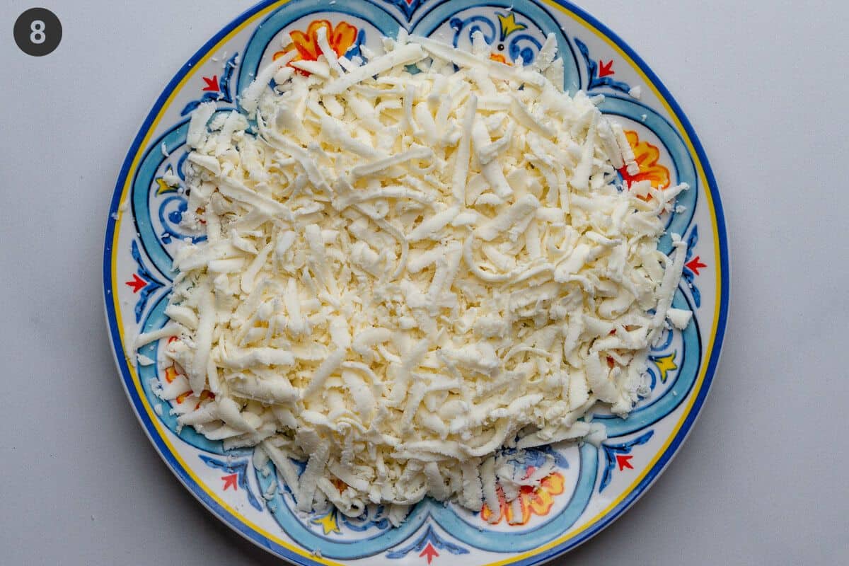 Grated mozzarella on a plate