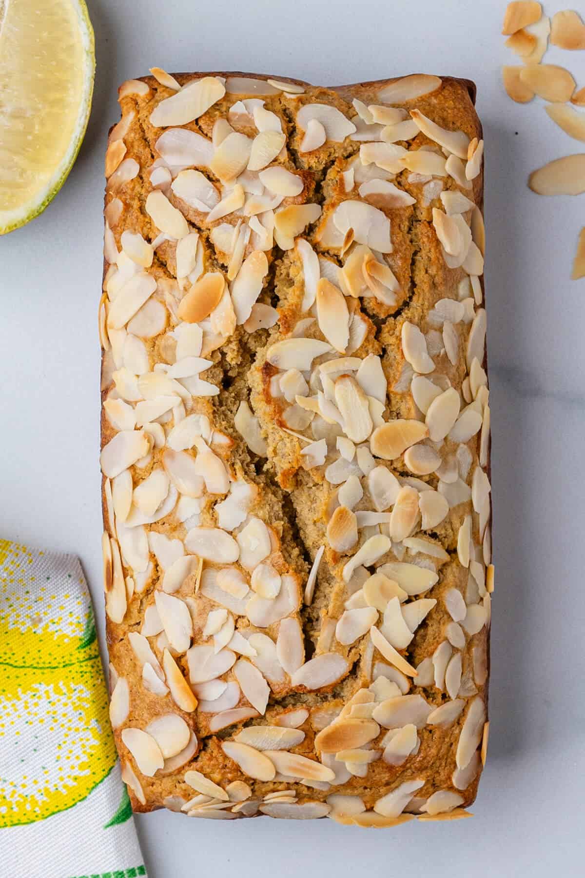 Baked loaf cake with almond flakes on top