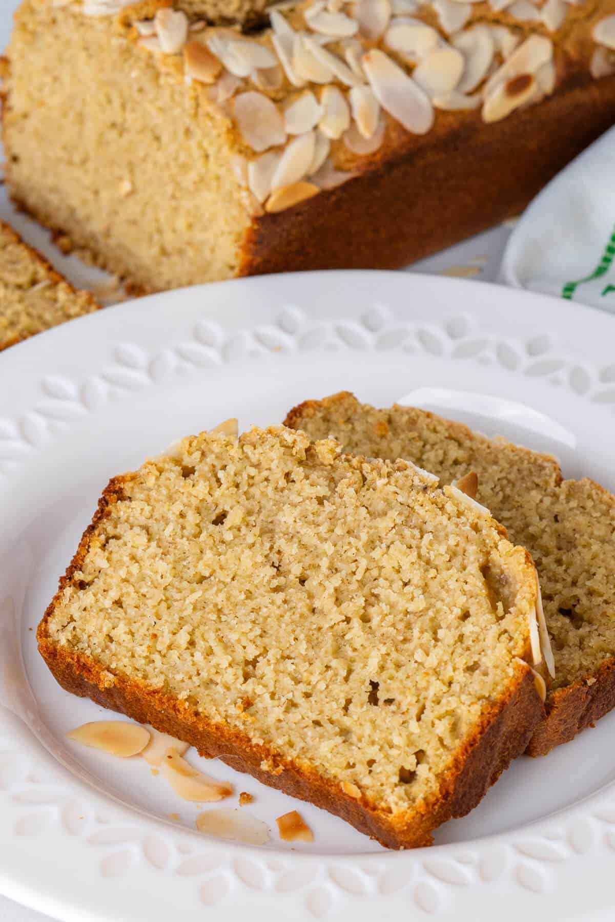 Two slices of lemon loaf cake on a plate