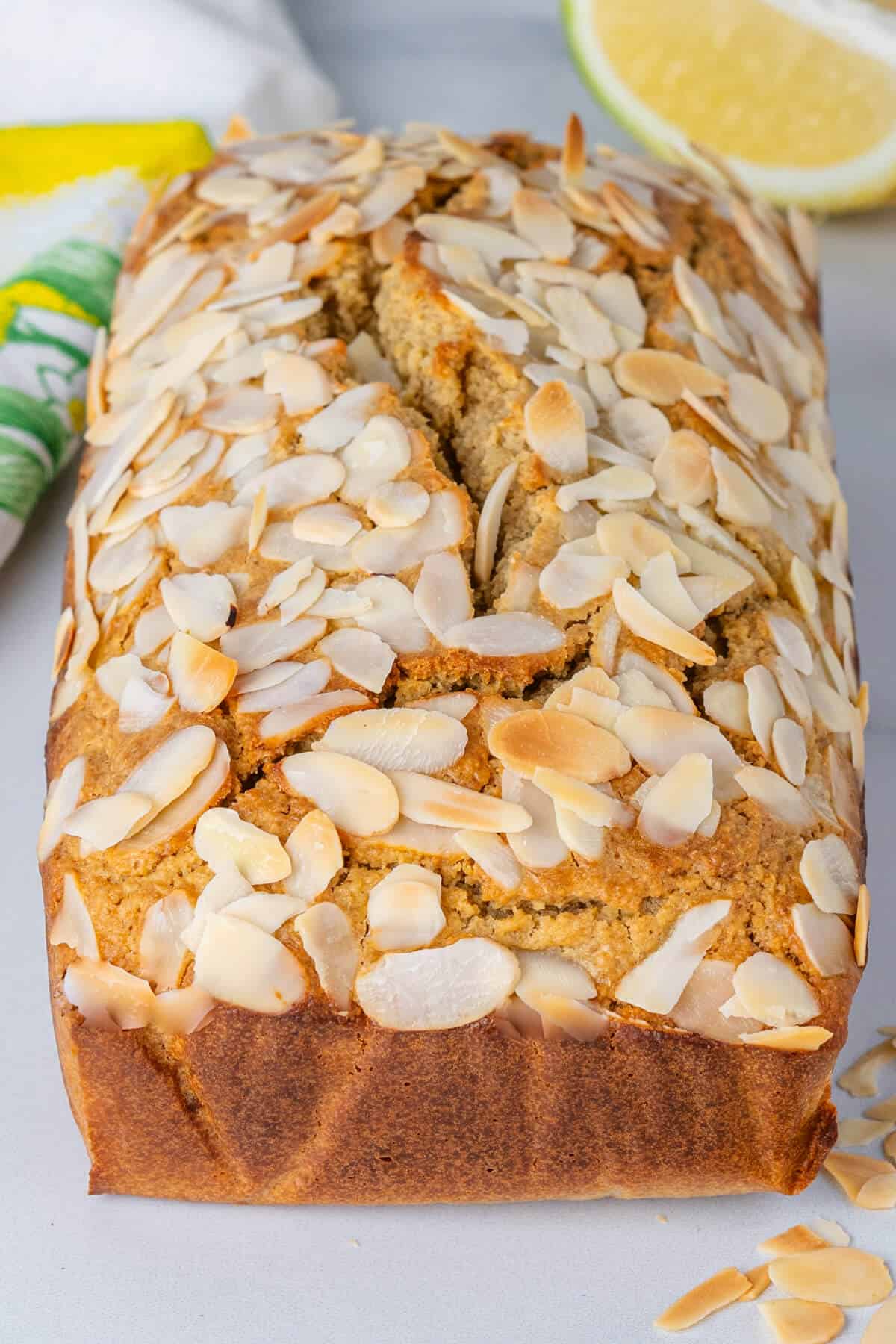 Whole loaf cake with flakey almonds on top