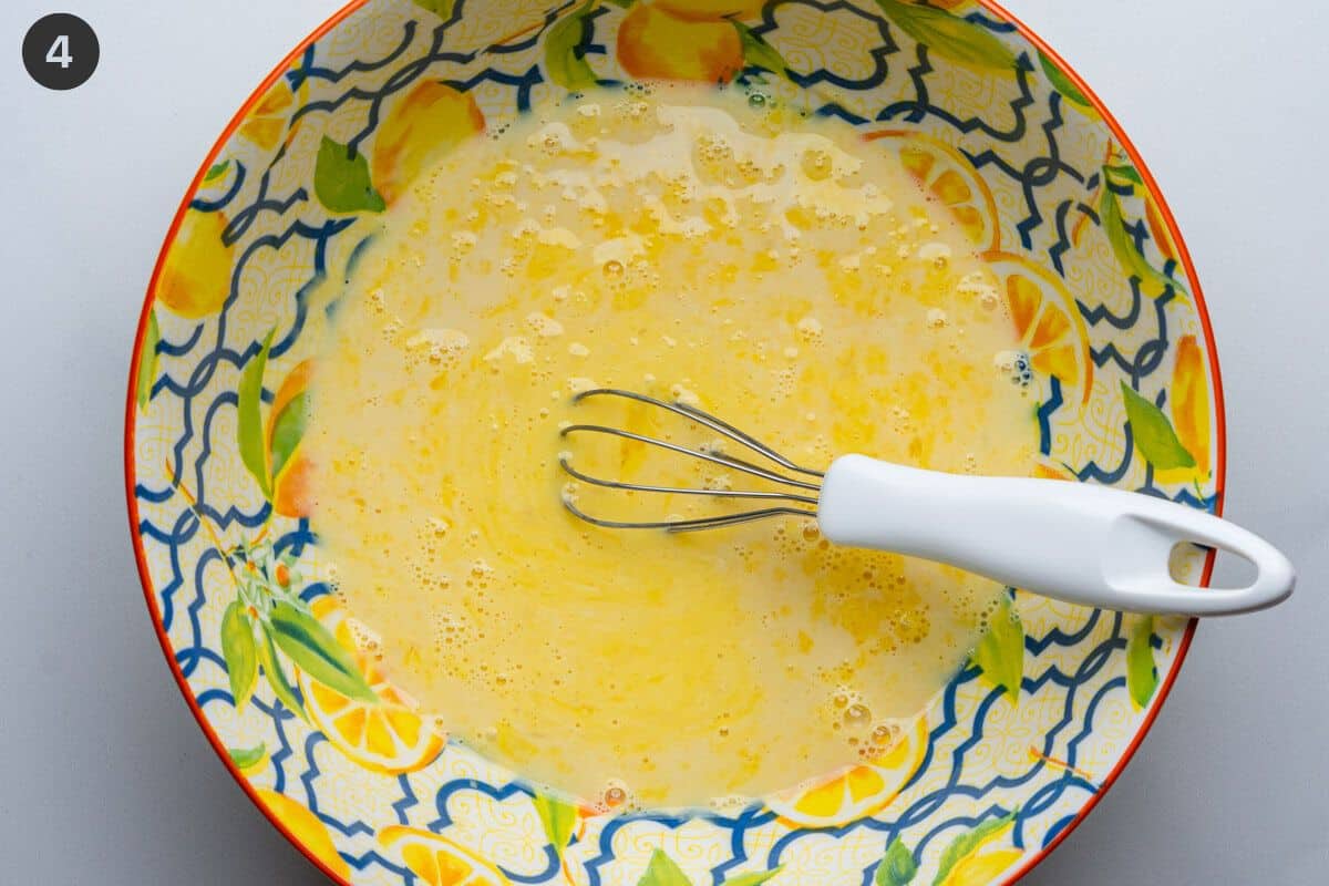 Milk, vanilla, lemon zest and juice add with eggs in a bowl