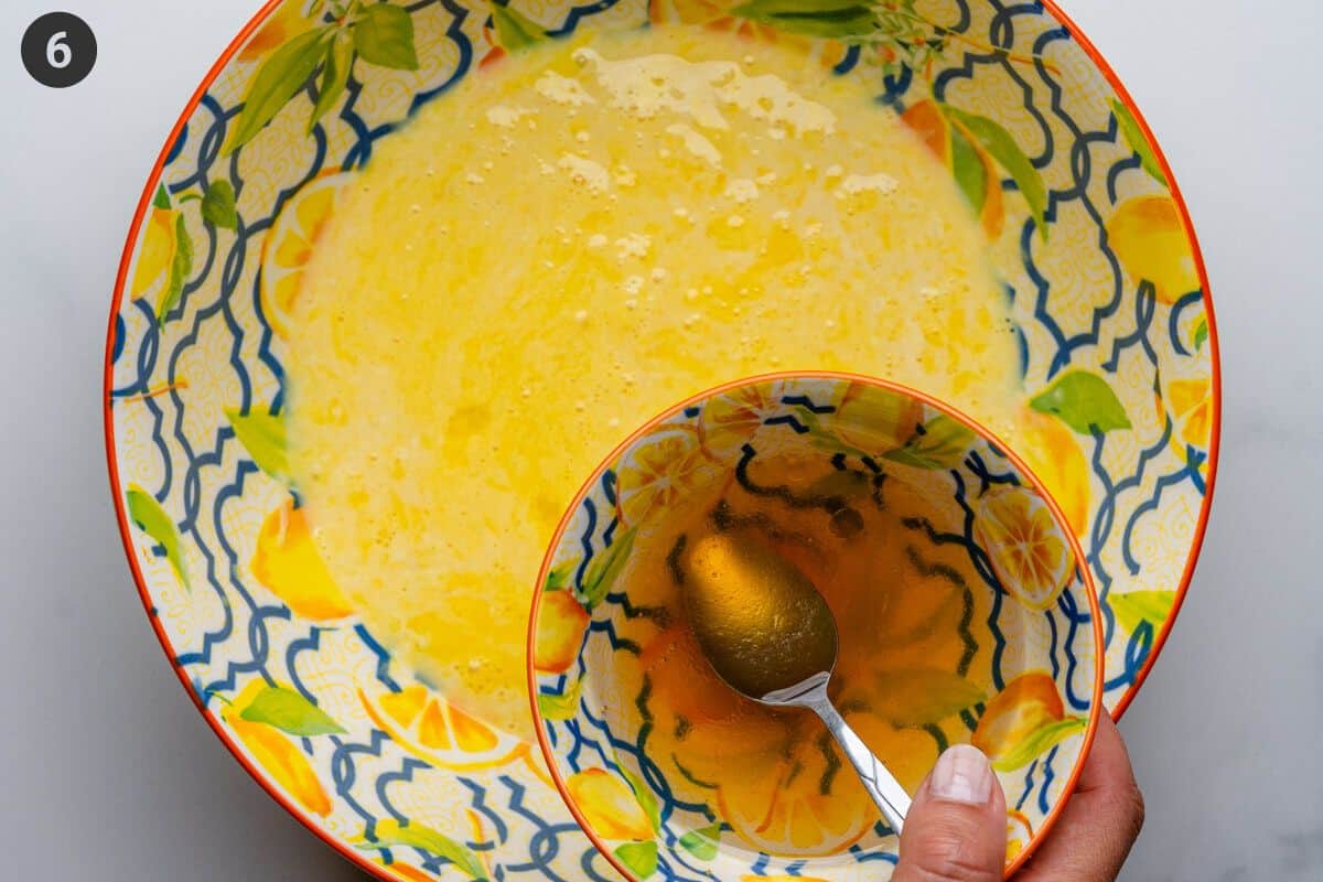 honey and coconut oil being poured into wet ingredients bowl