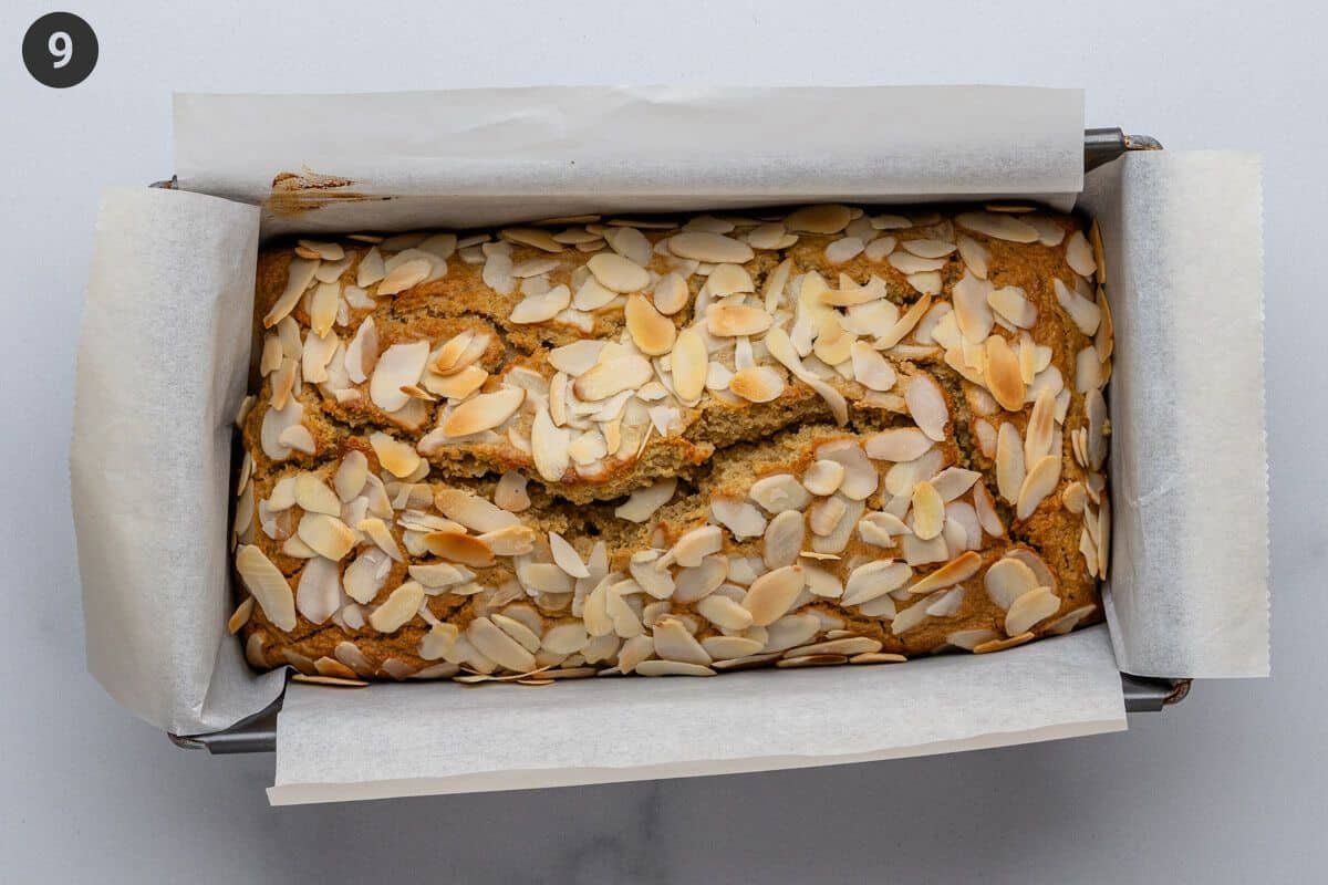 Baked loaf cake sitting in the loaf tin to cool