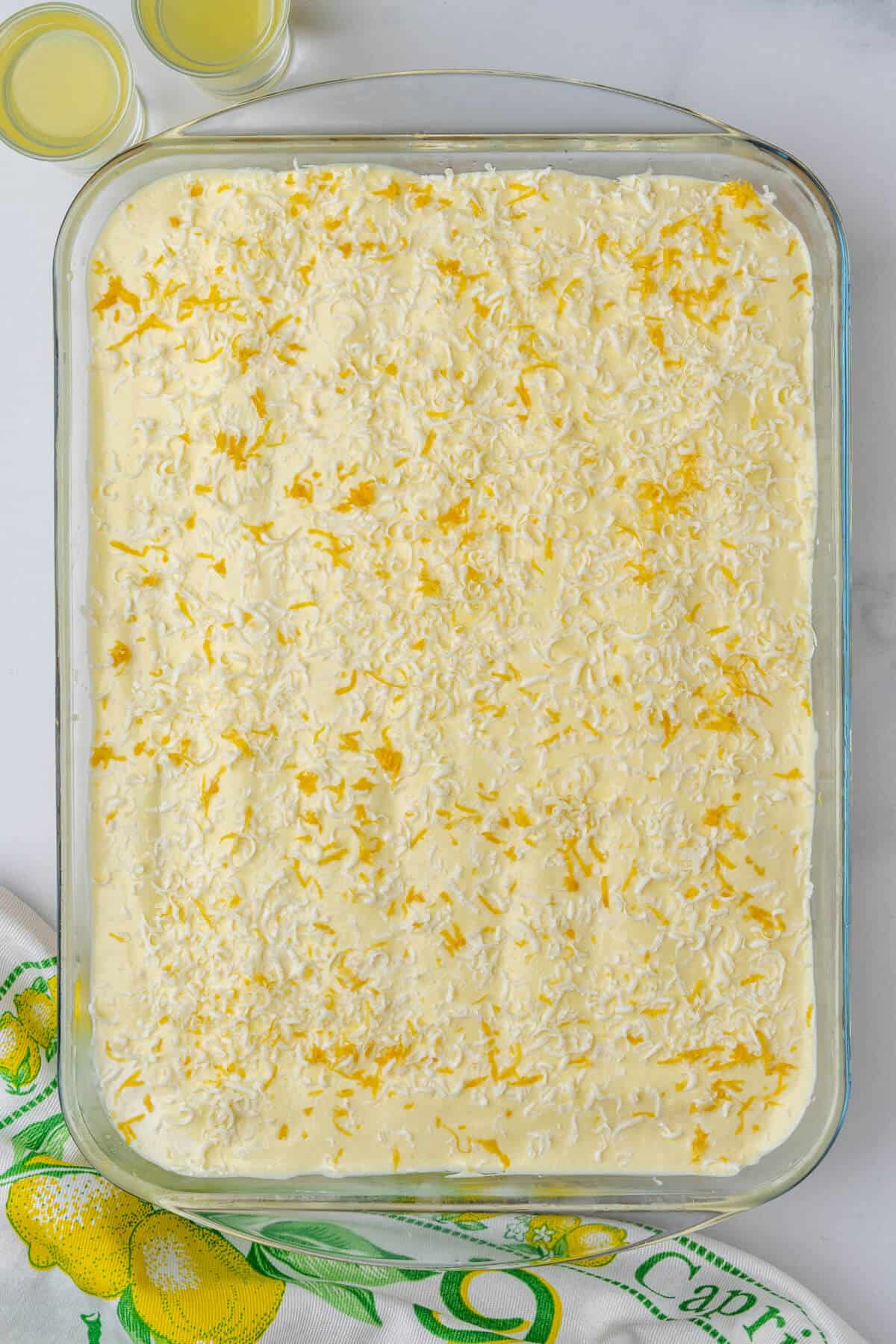 Full tray of limoncello tiramisu with grated lemon zest and white chocolate on top