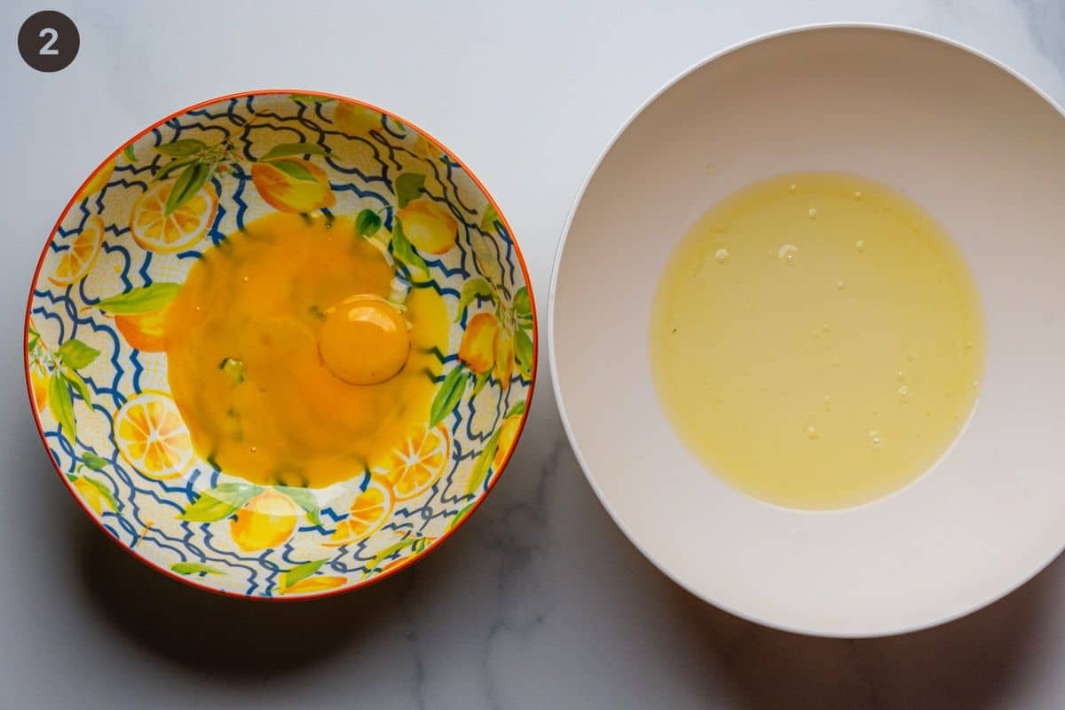 Egg yolks and egg whites in separate bowls