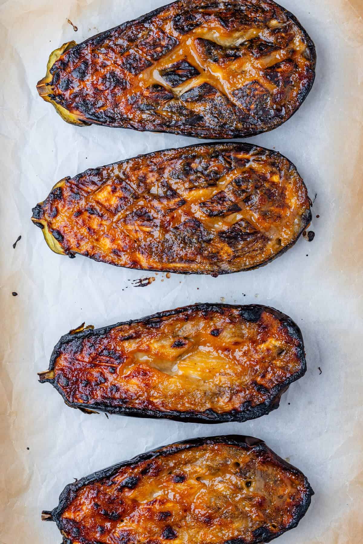 Cooked eggplants on a baking tray