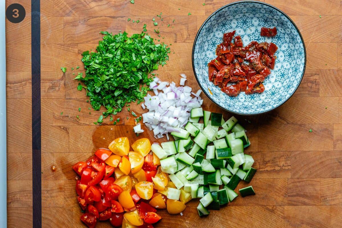 Chopped salad ingredients on a cutting board