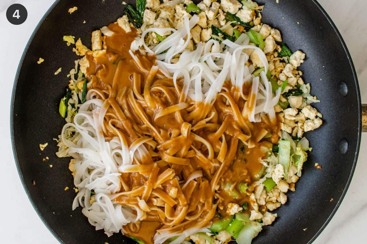 Peanut sauce and cooked noodles in a pan