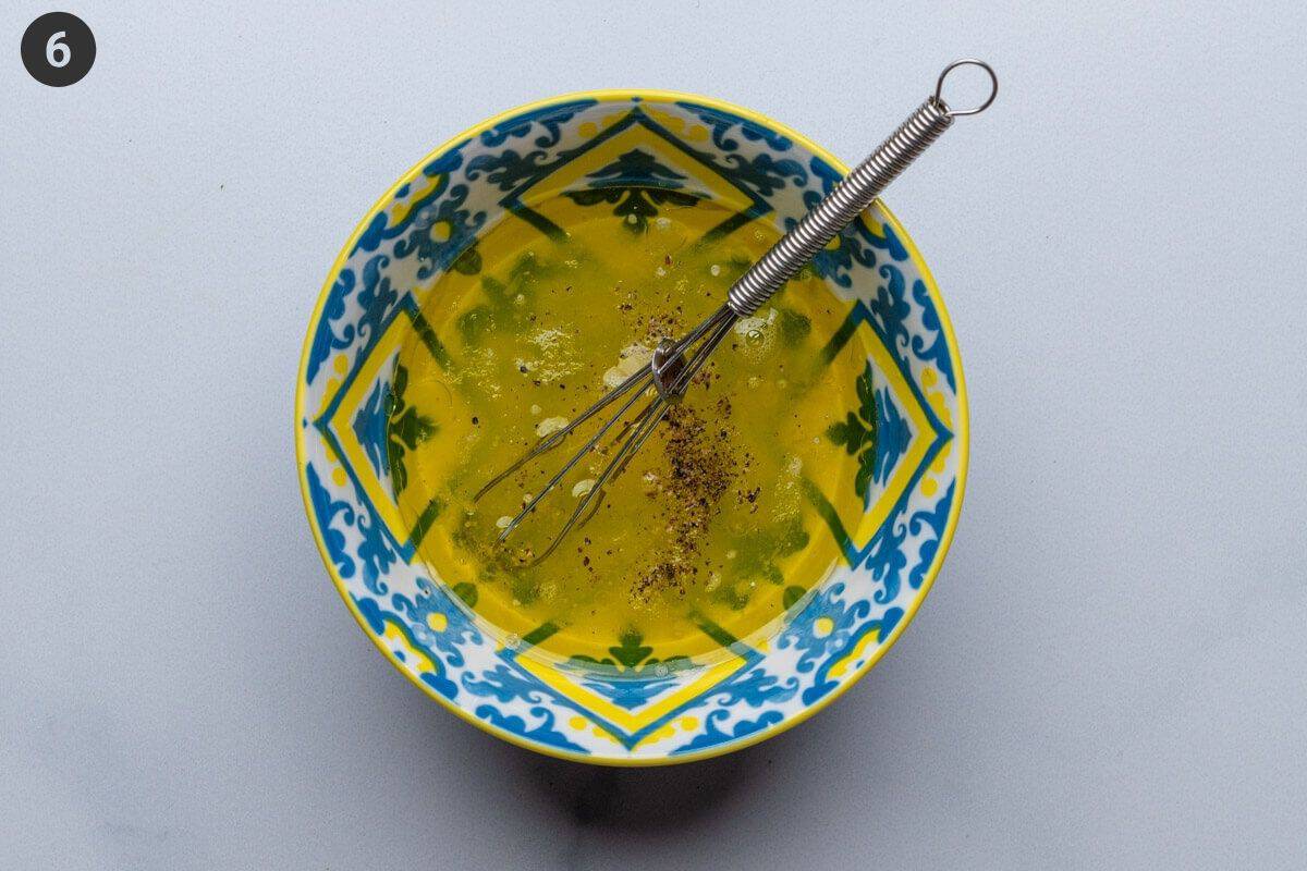Olive oil and lemon dressing in a small bowl