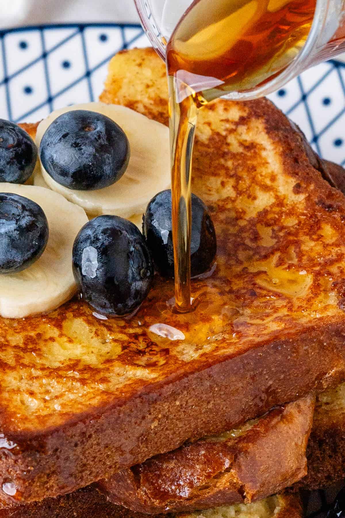 Close up of maple syrup poured on toast