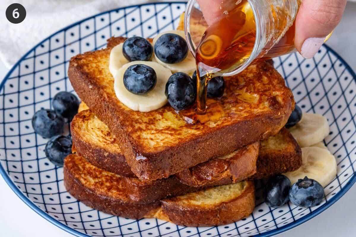 Maple syrup being poured on toasts