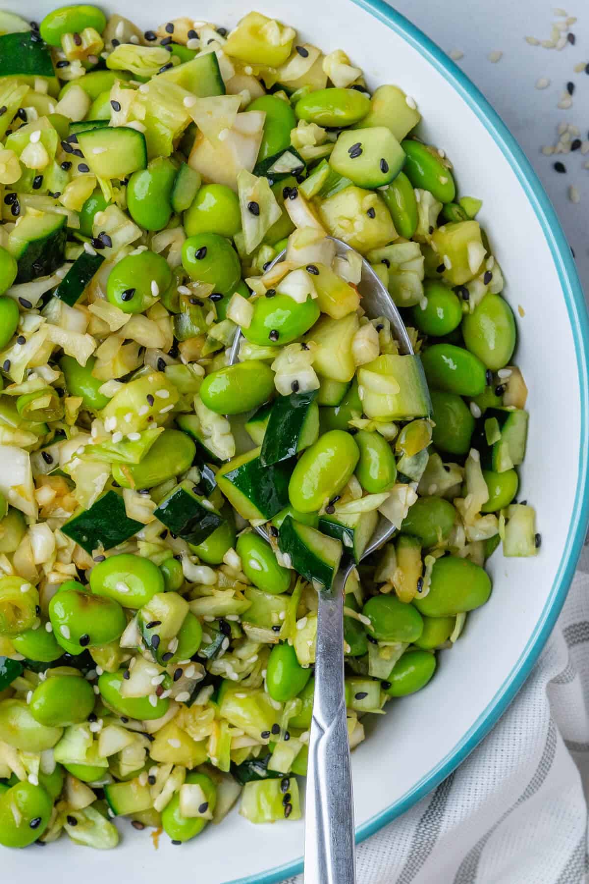 Focus on spoon in salad bowl