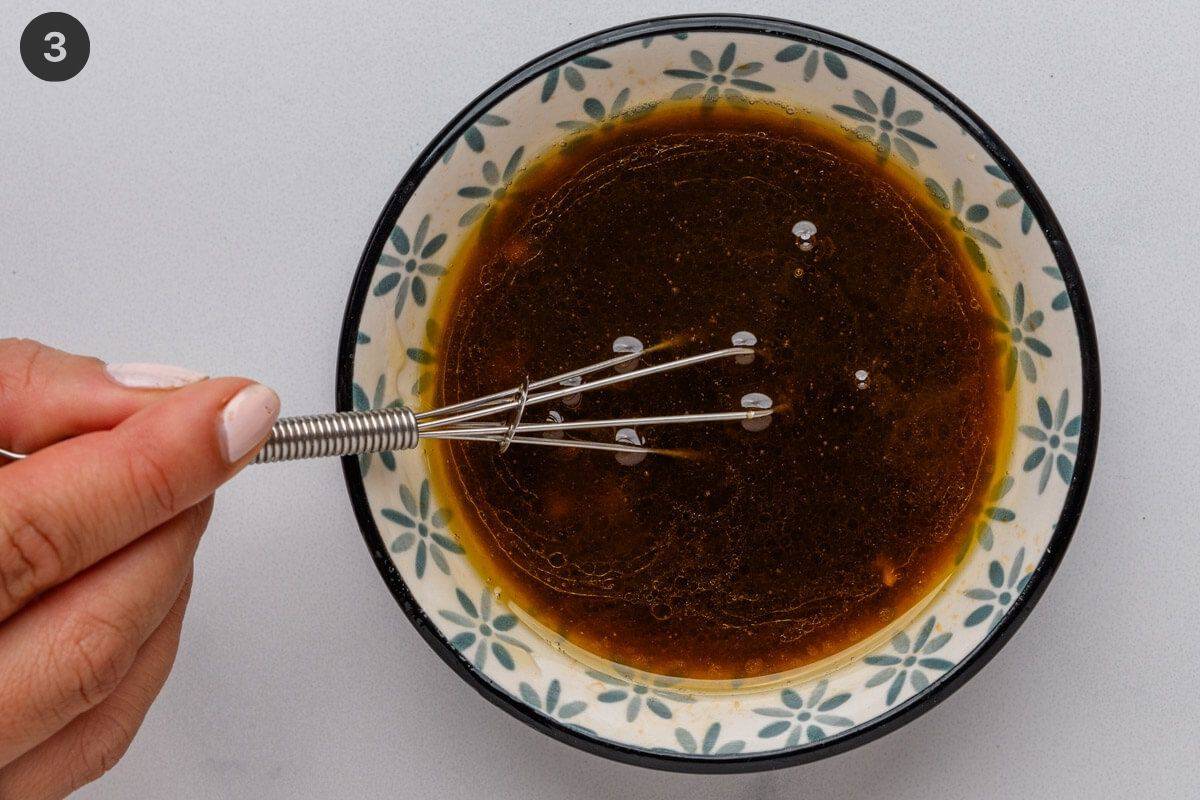 Sesame dressing whisked in a bowl