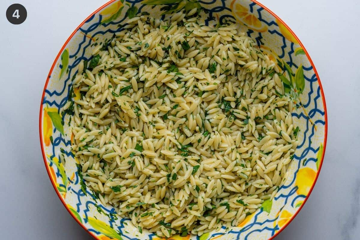 Orzo pasta mixed with oil and parsley