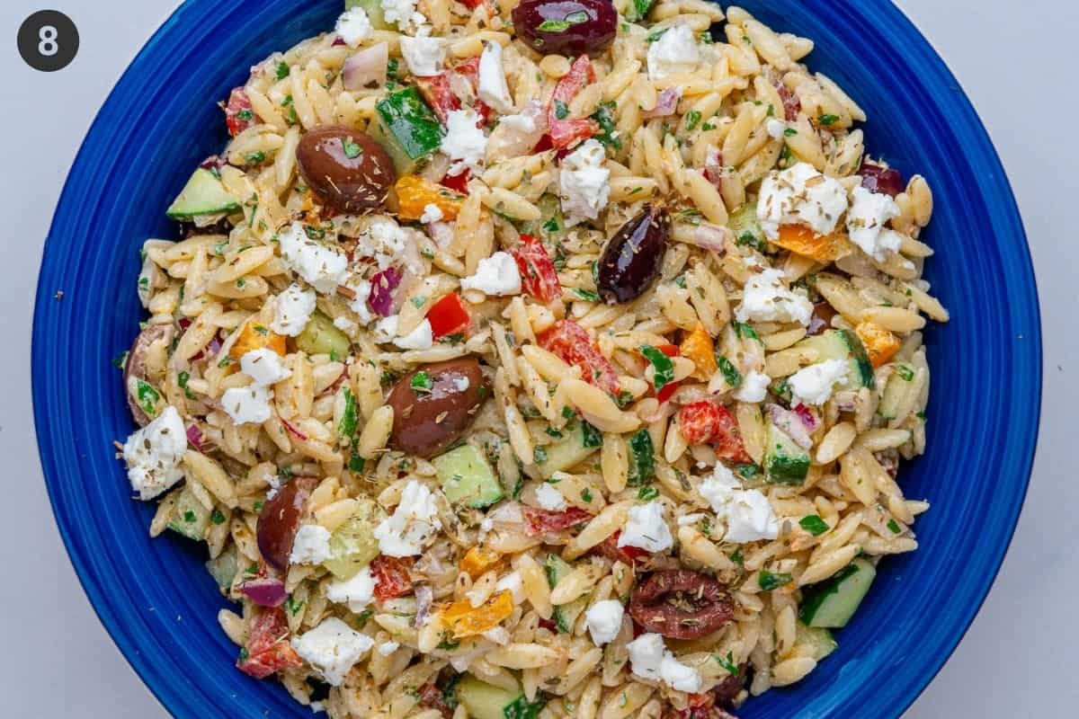 Final orzo salad topped with feta and oregano