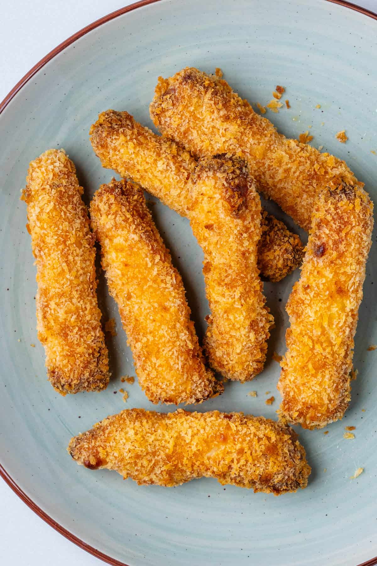 Halloumi fries on a plate that have been cooked in an air fryer