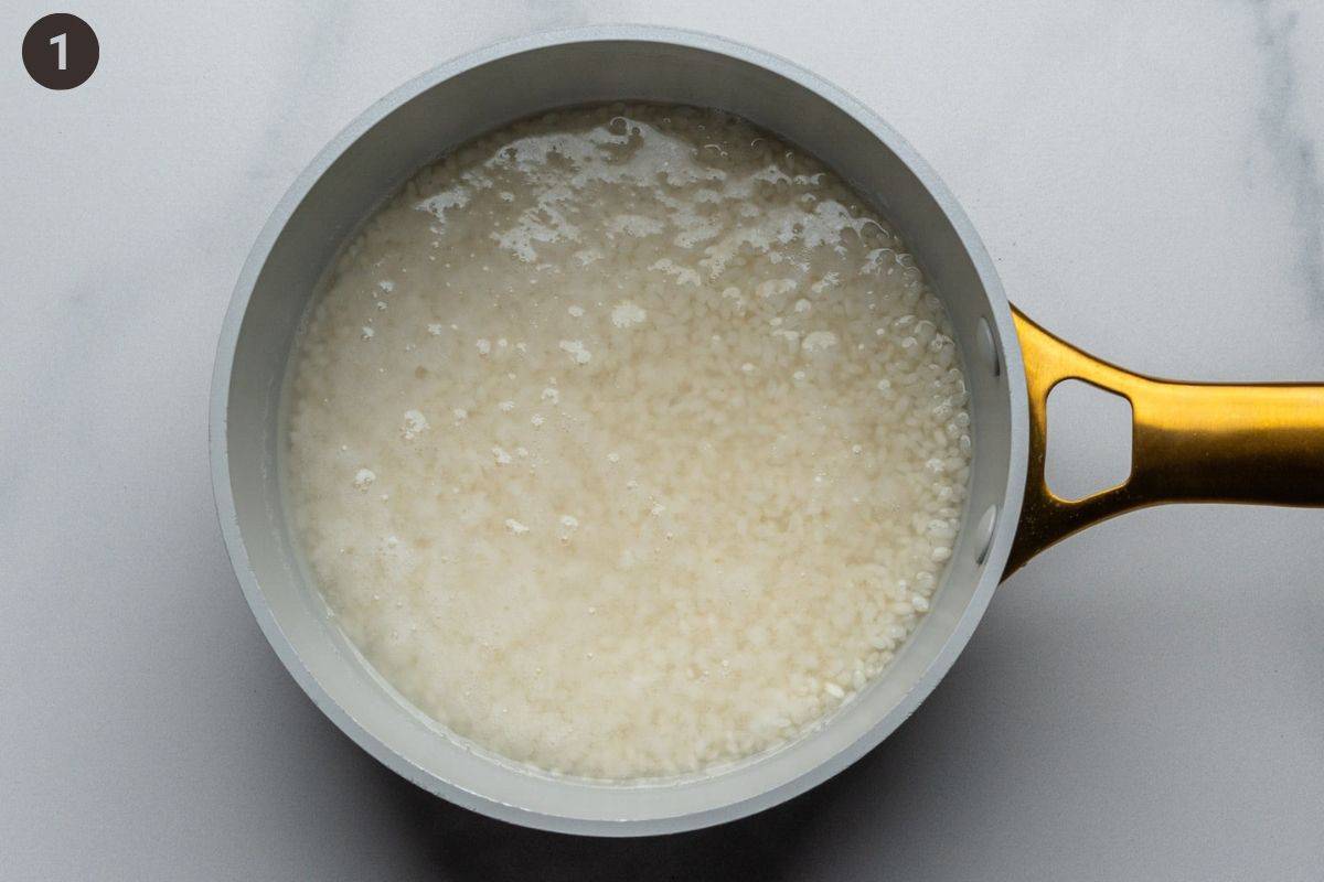 Sushi rice being cooked in a pot