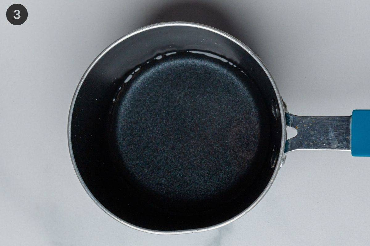 Rice seasoning being prepared in a small pot