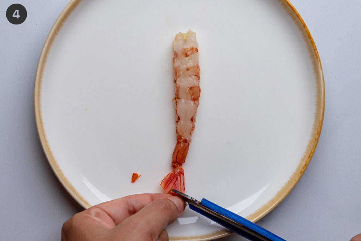 Tail of shrimp being trimmed