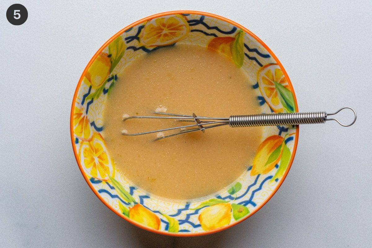 Miso paste in a small bowl with a whisk