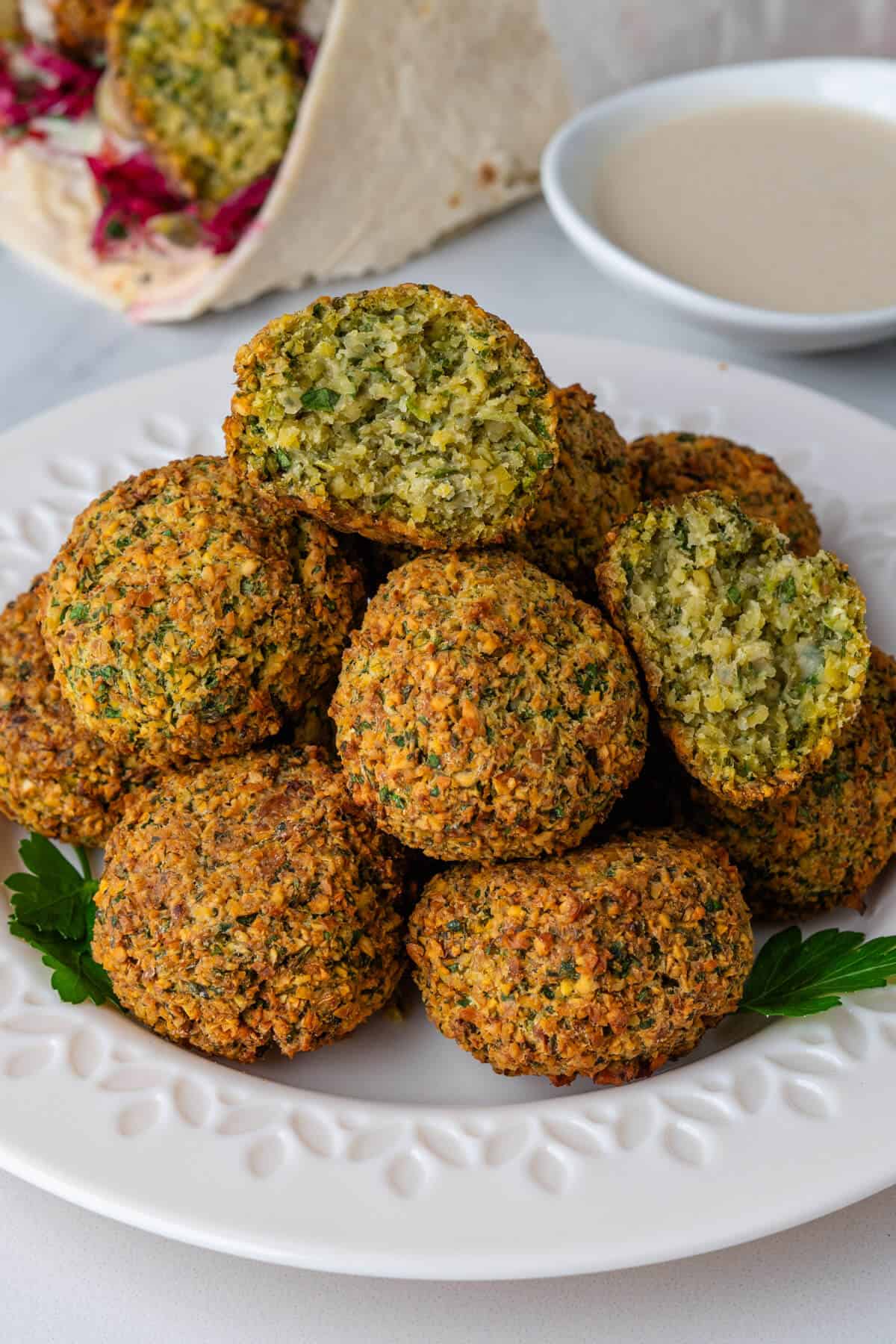 Falafel on a plate with one ball cut in half