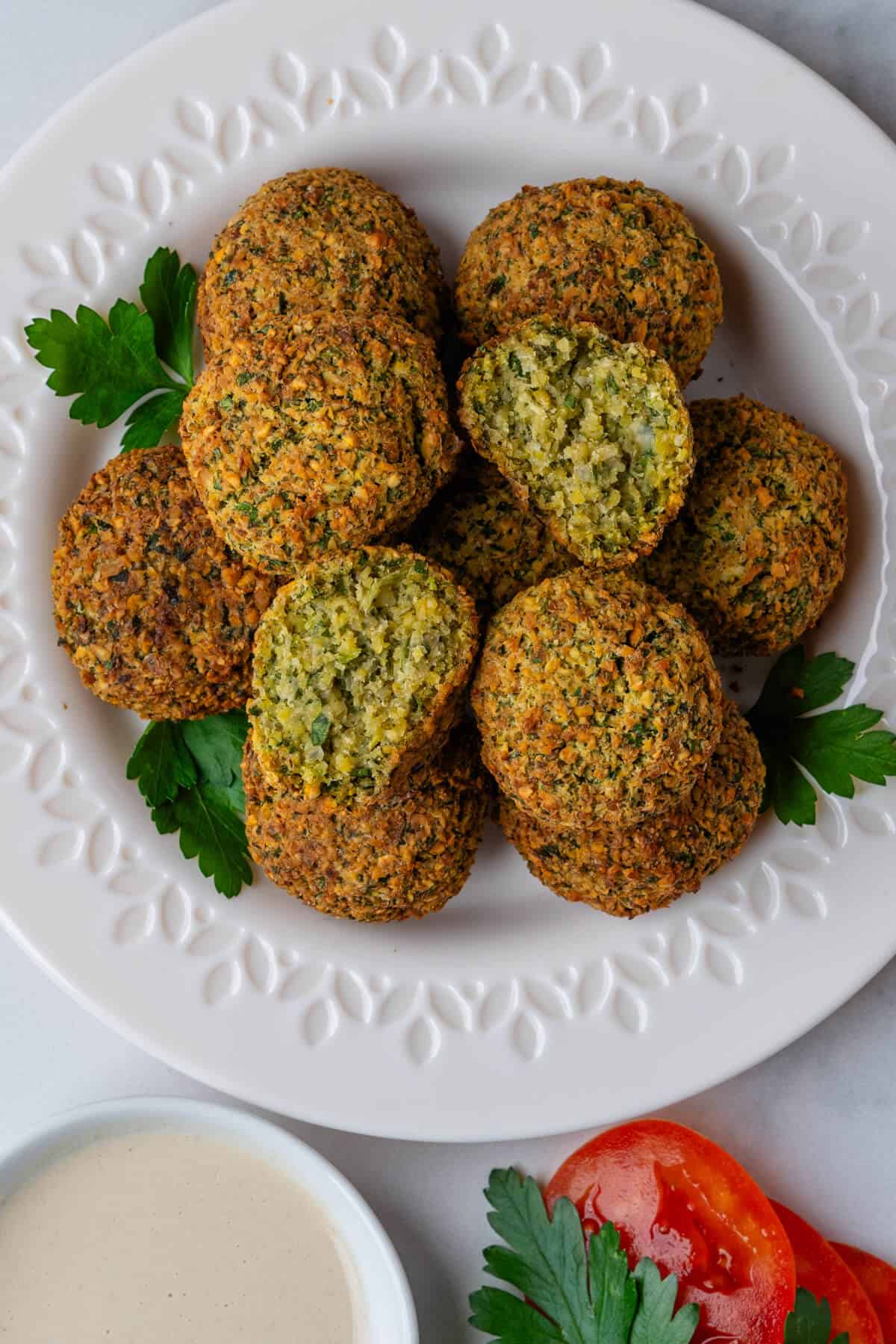 Air Fryer Falafel on a plate with one ball cut in half