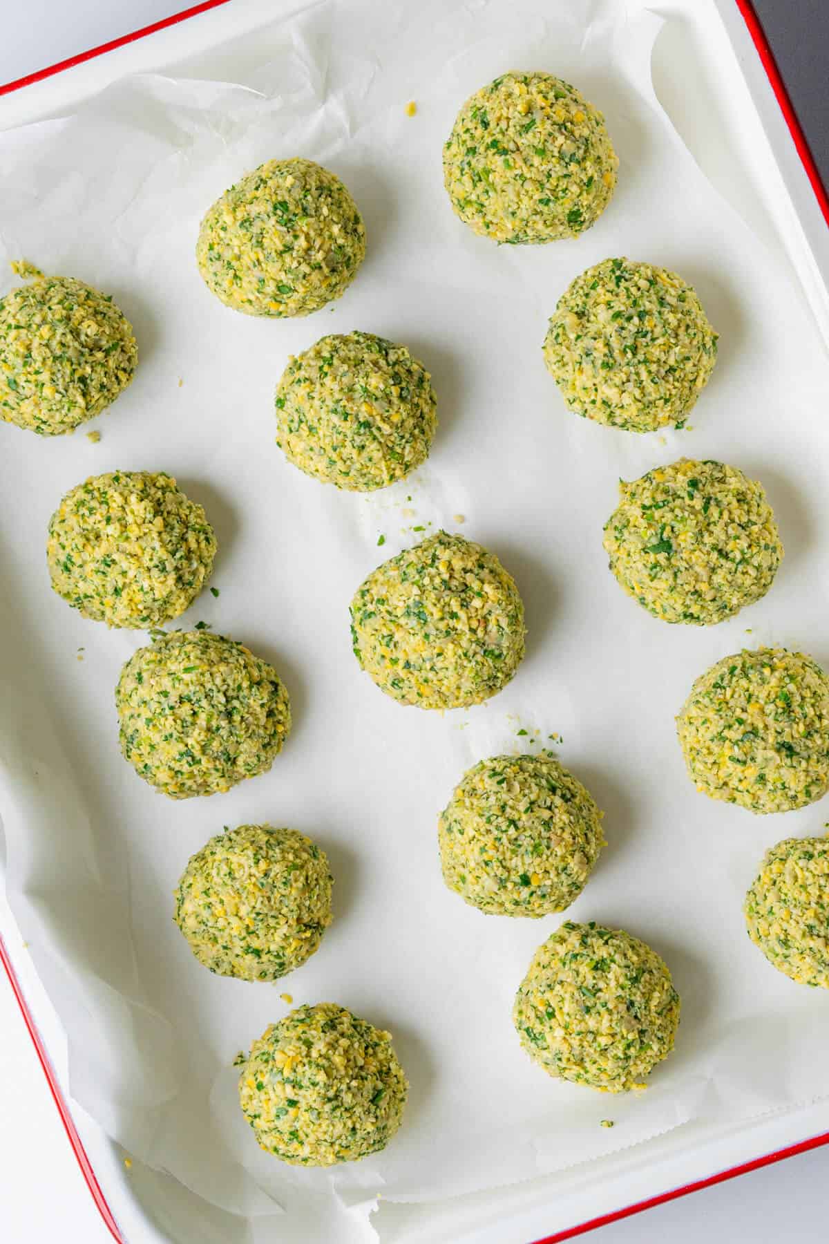 Falafel balls on oven tray before being cooked