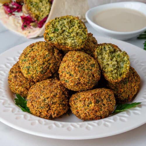 Air Fryer Falafel with one ball cut in half to show the inside