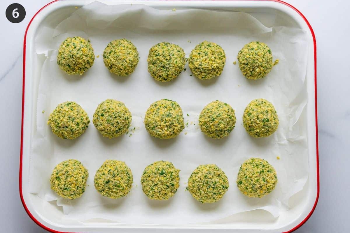 Balls of falafel on an oven tray before being cooked