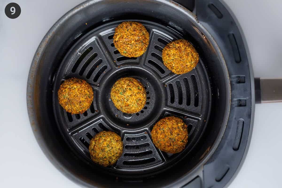 Cooked falafel balls in the air fryer basket