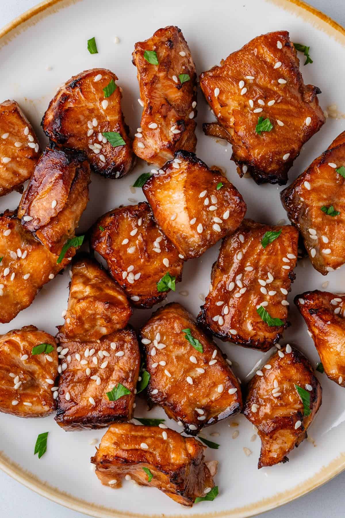 Air fryer salmon bites on a plate with sesame seeds