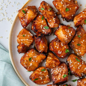 Air fryer salmon bites with sesame seeds on top