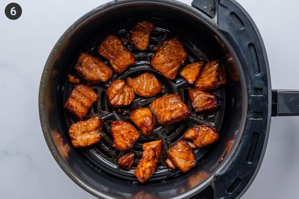 Cooked salmon in air fryer basket