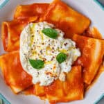 Burrata pasta in a bowl with fresh burrata on top