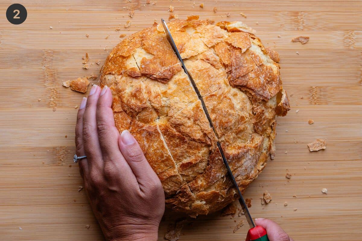 Cutting slits into big loaf of crusty bread