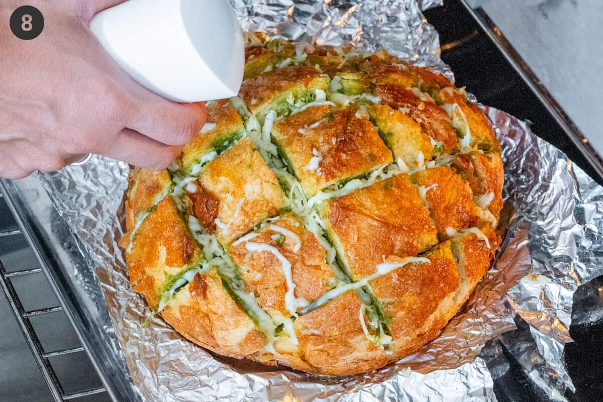 Oil being sprayed onto bread half way during cook