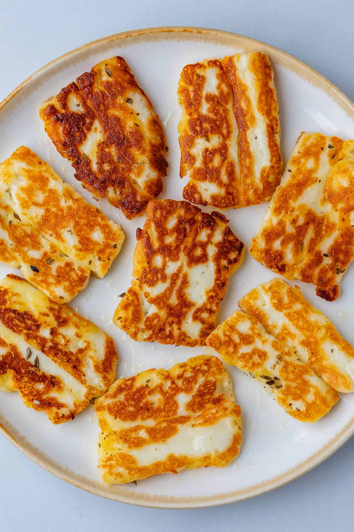 Grilled halloumi pieces on a plate