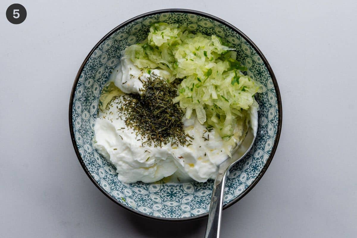 Tzatziki in a bowl being mixed