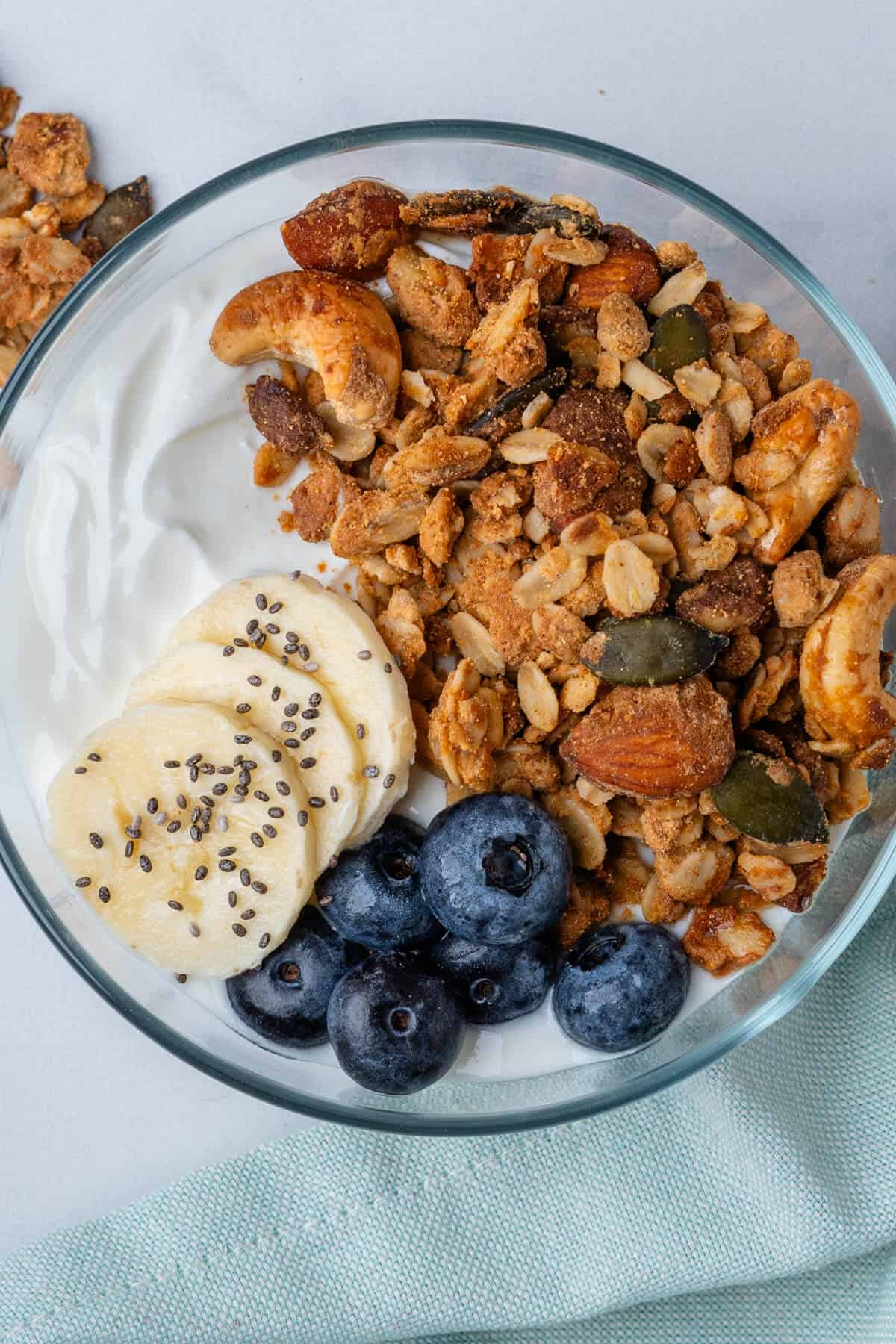 Protein granola in a bowl with yogurt, berries and banana