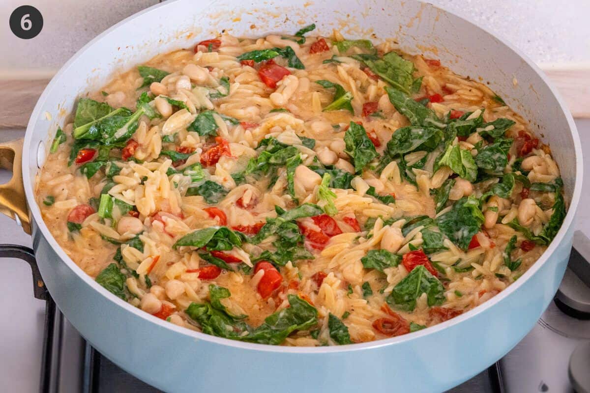 orzo pasta being cooked in final stages in a pan