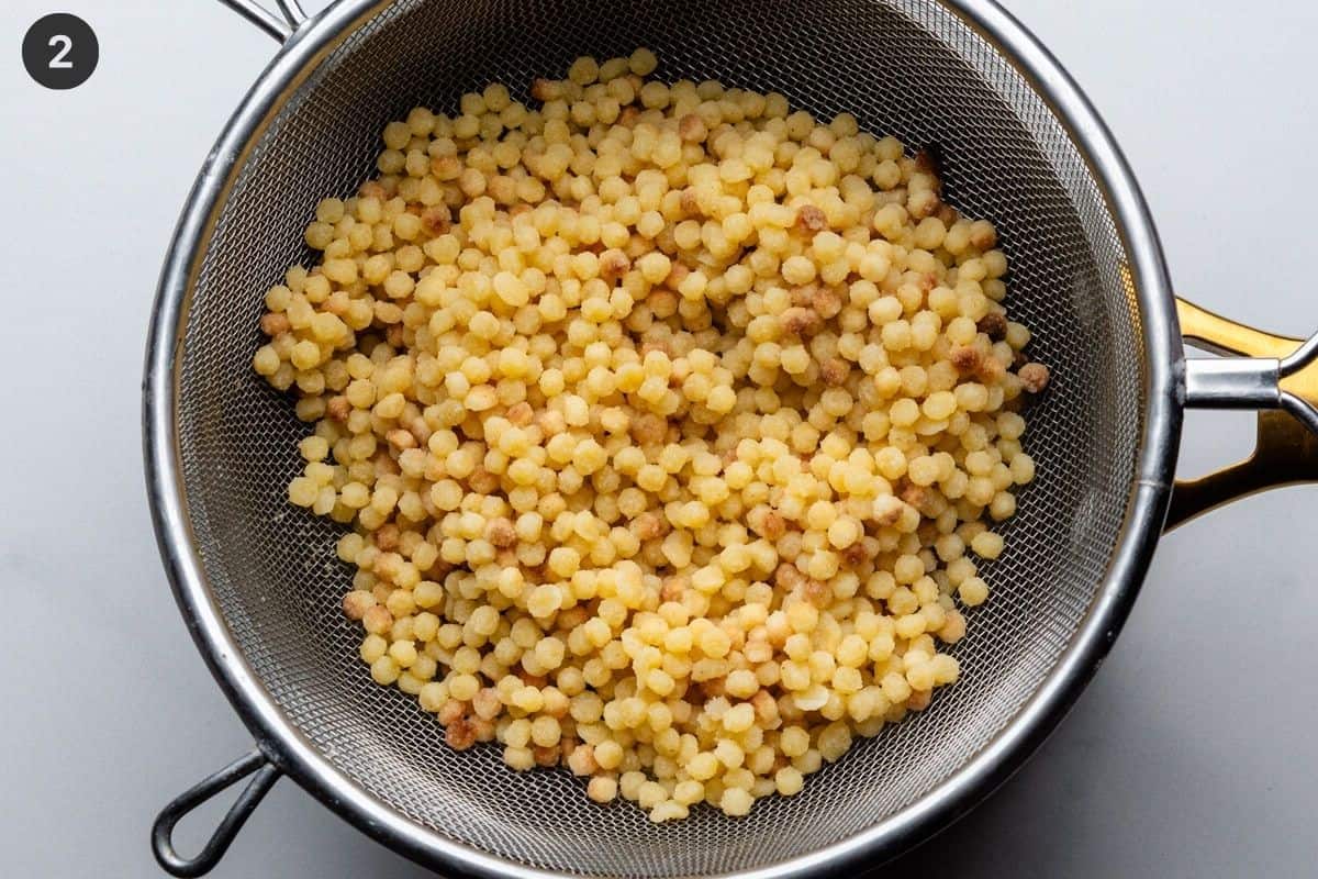 Fregula pasta cooked and drained