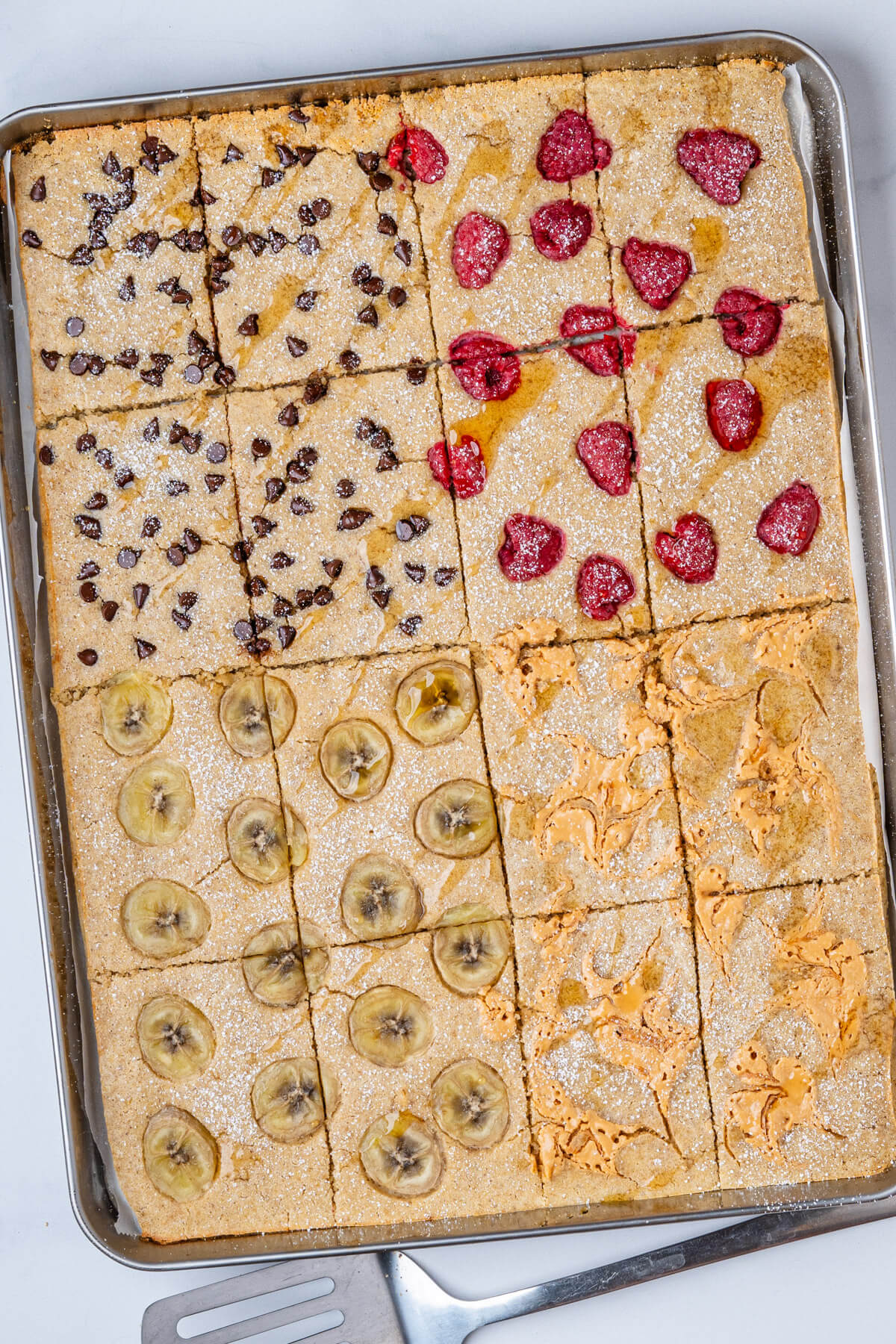 Pancakes on baking tray with four toppings