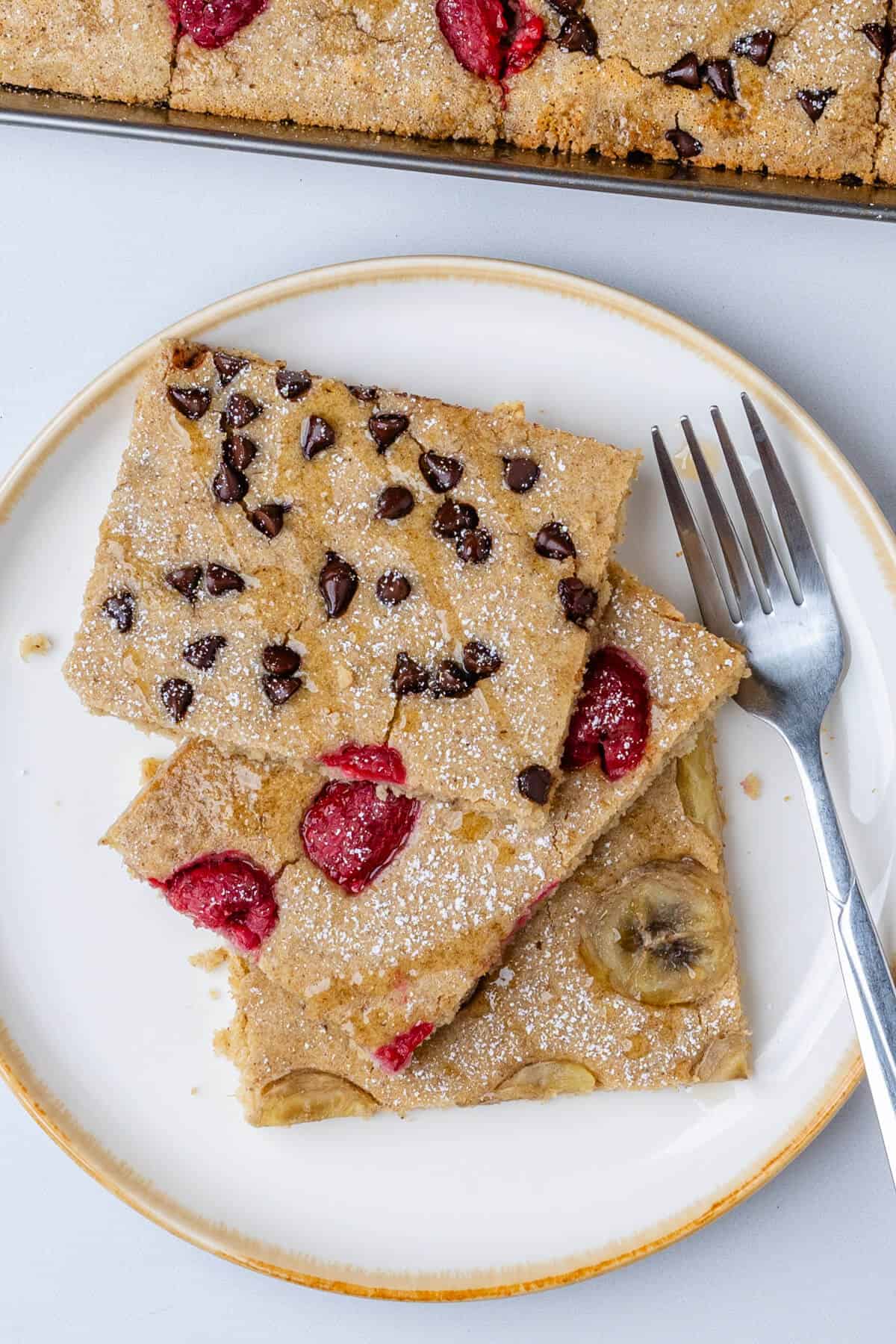 Pancakes served on a plate with a fork