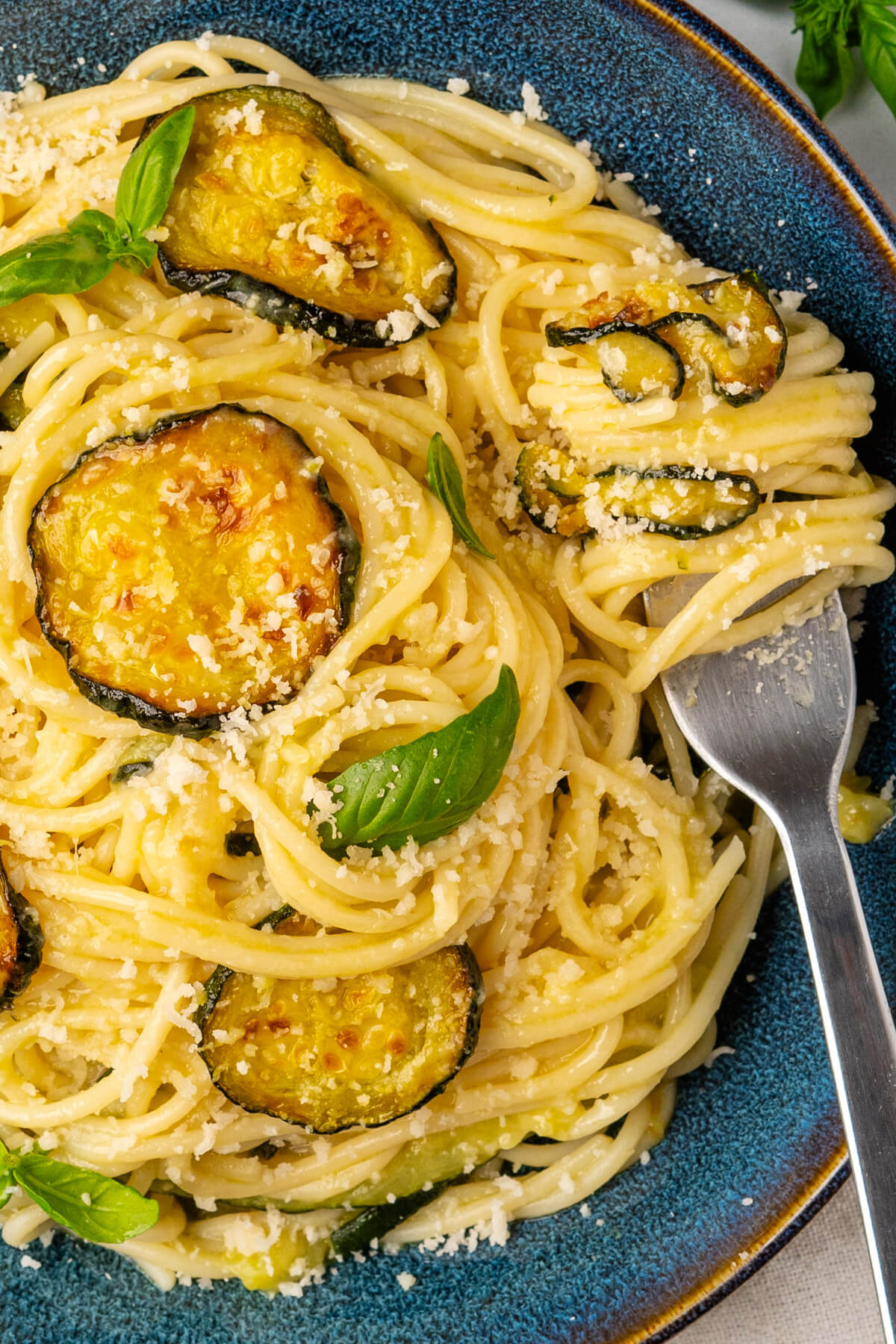 Spaghetti alla Nerano with a fork in a bowl