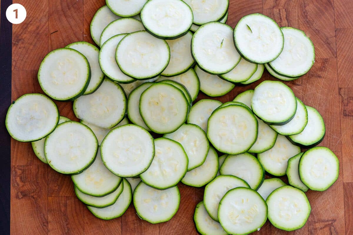 Sliced zucchini pieces on a cutting board