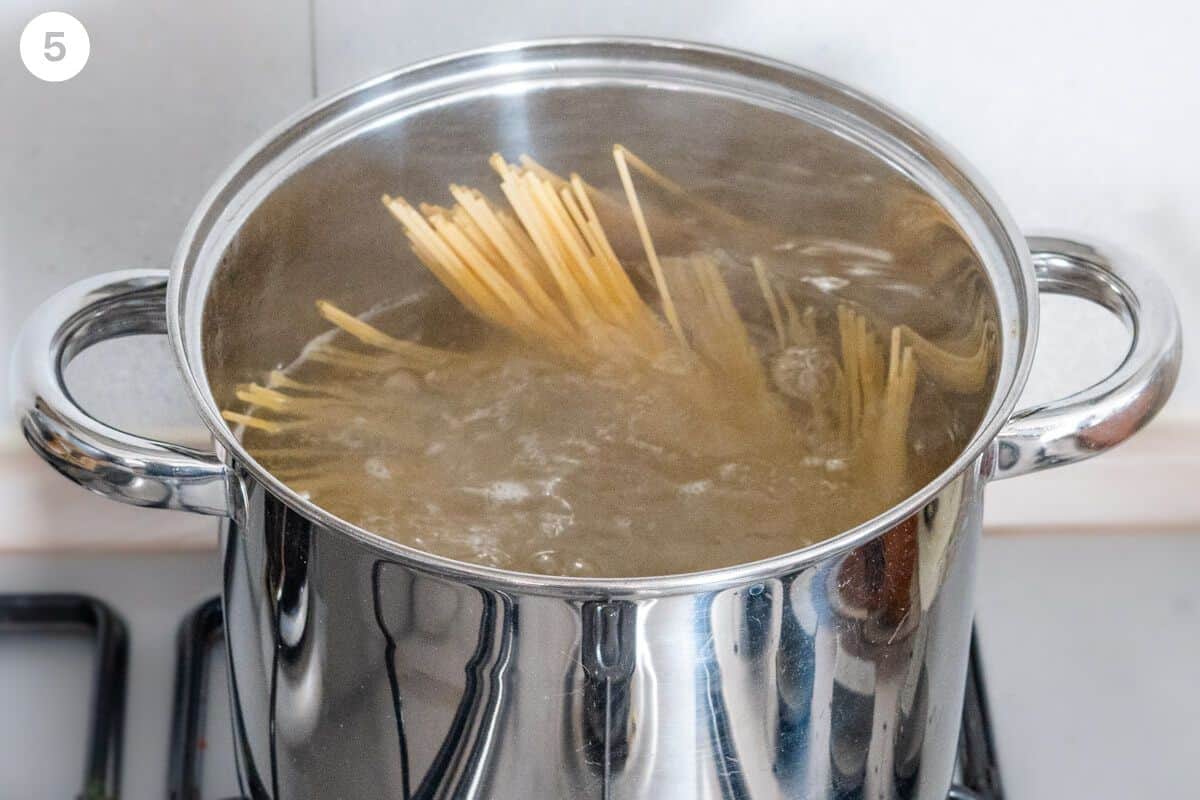 Pasta being cooked in a pot of boiling water