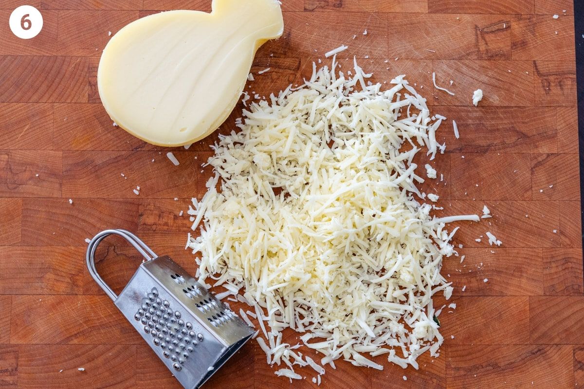 Provolone cheese grated on a cutting board