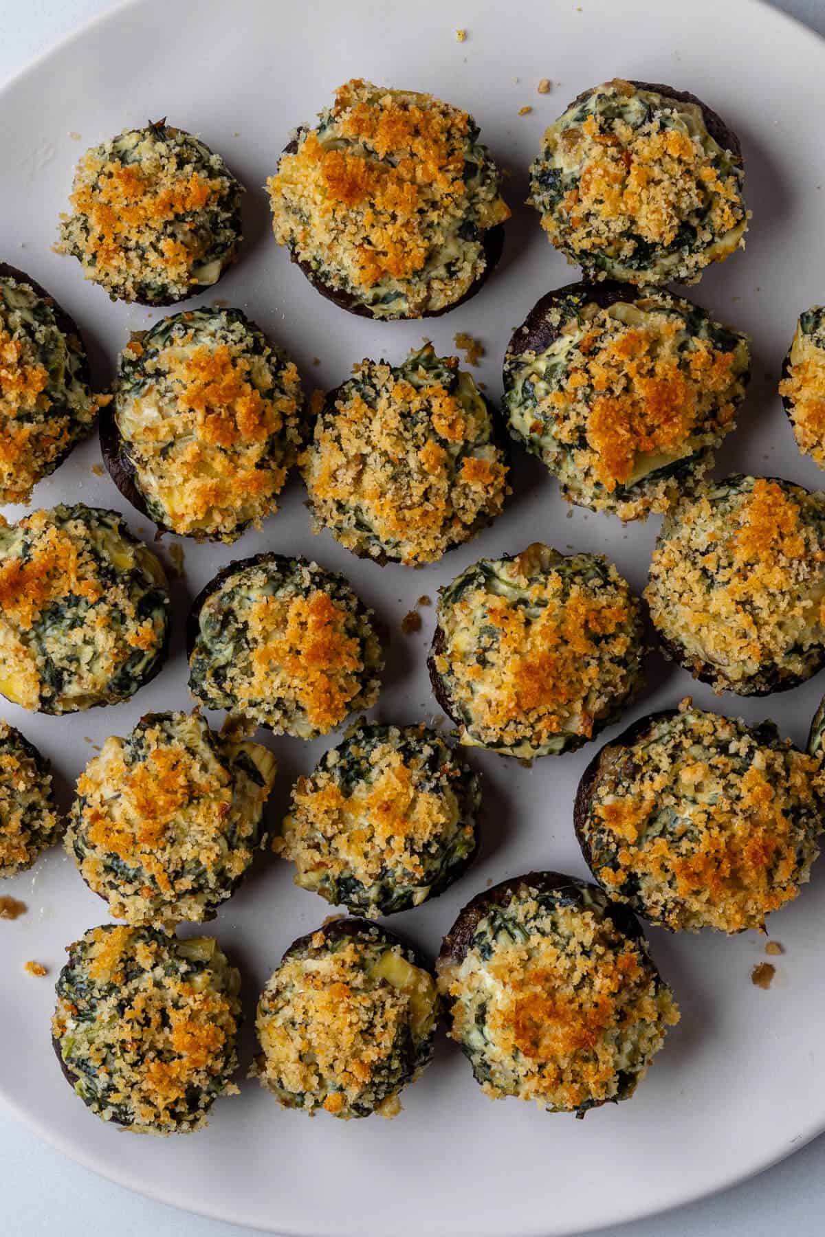 Stuffed mushrooms on a plate with crispy breadcrumbs