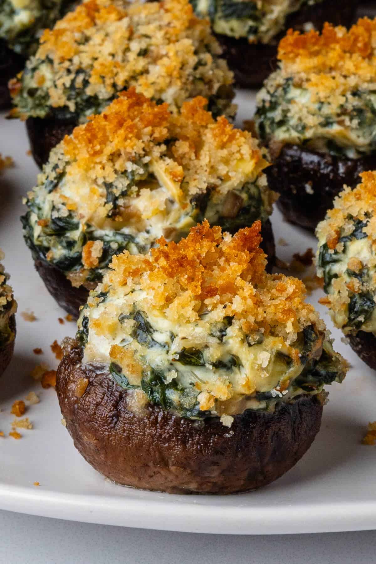 Stuffed mushrooms on a plate with crispy breadcrumbs